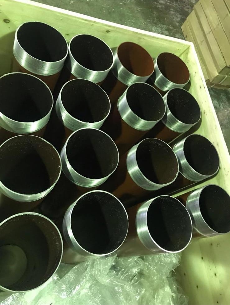 UKPN Cut Pieces Metal cut pipe pieces stacked in a wooden crate.